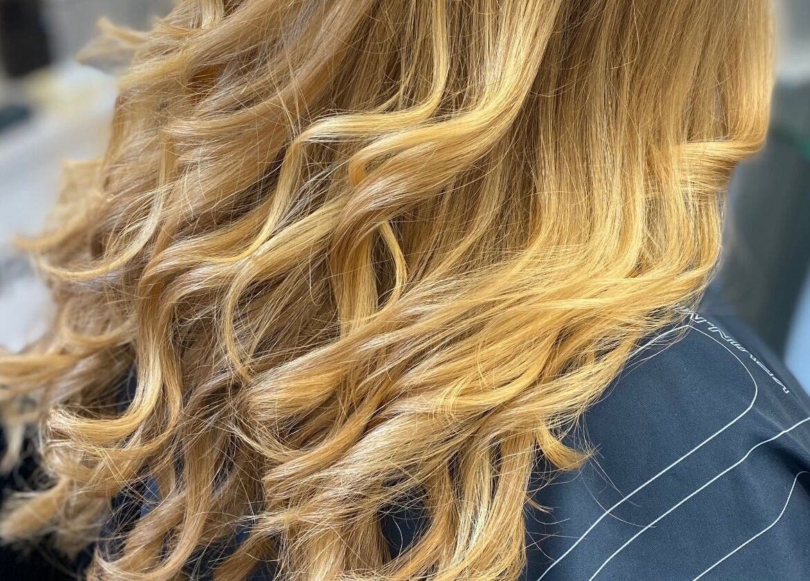 Golden hair waves styled at House of Hair, Somerton, England, GB for a stunning salon finish.