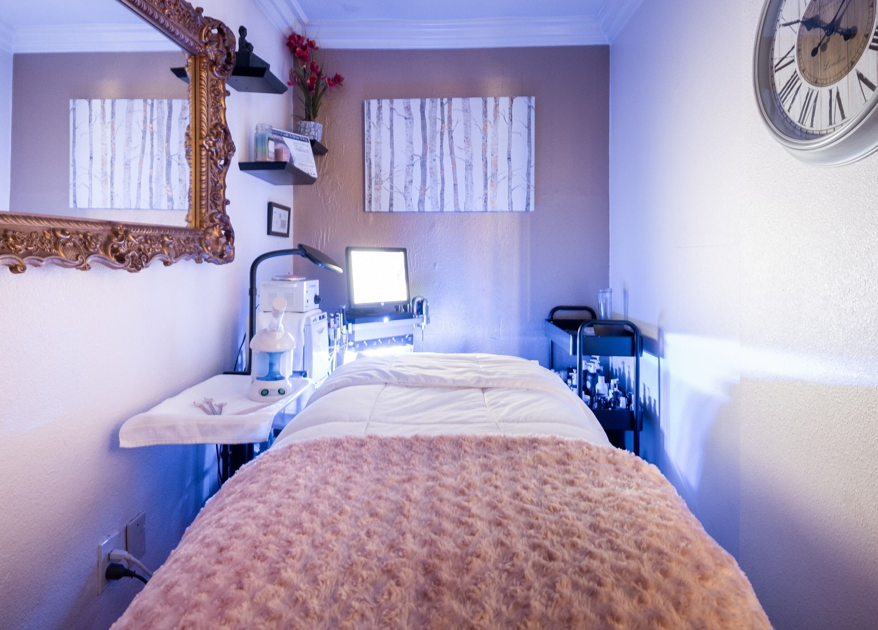Calm treatment room at Bright Esthetics in Yucaipa, California, US with a spa bed and elegant decor.