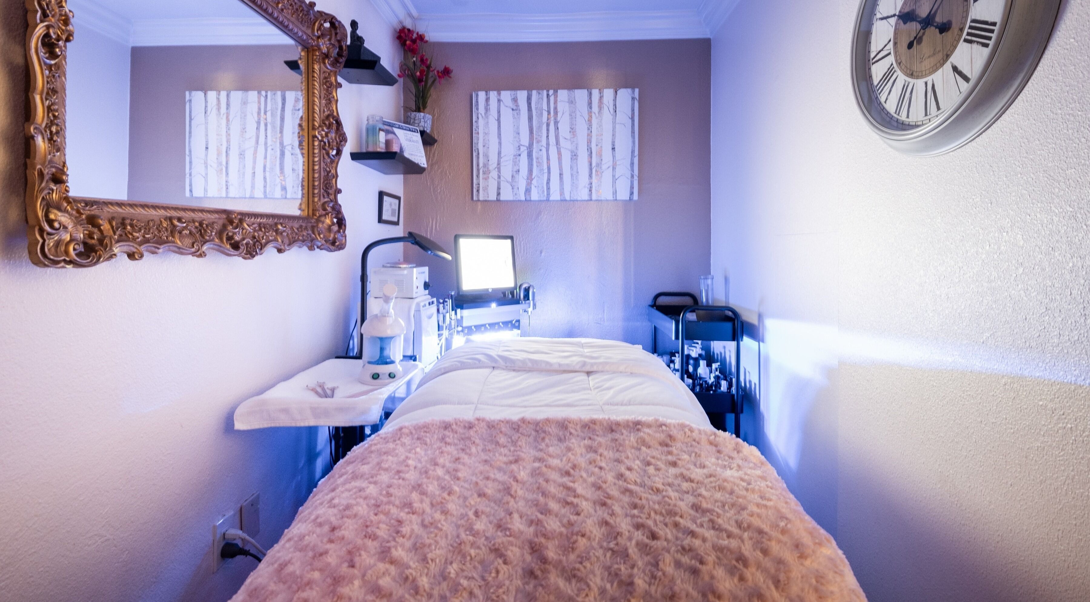 Calm treatment room at Bright Esthetics in Yucaipa, California, US with a spa bed and elegant decor.