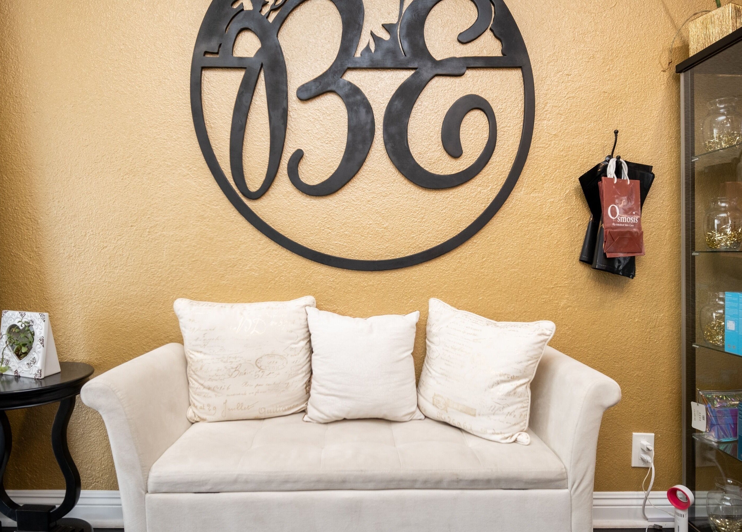 Welcoming seating area with plush sofa at Bright Esthetics, Yucaipa, California, US.