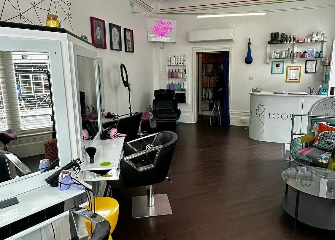 Modern interior of The Look salon in Abingdon, England, GB features stylish seating and sleek design.