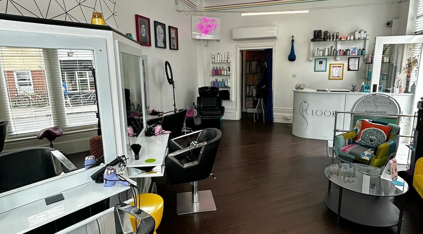 Modern interior of The Look salon in Abingdon, England, GB features stylish seating and sleek design.