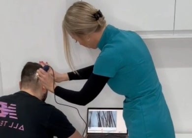Expert conducting scalp analysis at 360 Hair Clinic, Brighton And Hove, England, GB, on a client.
