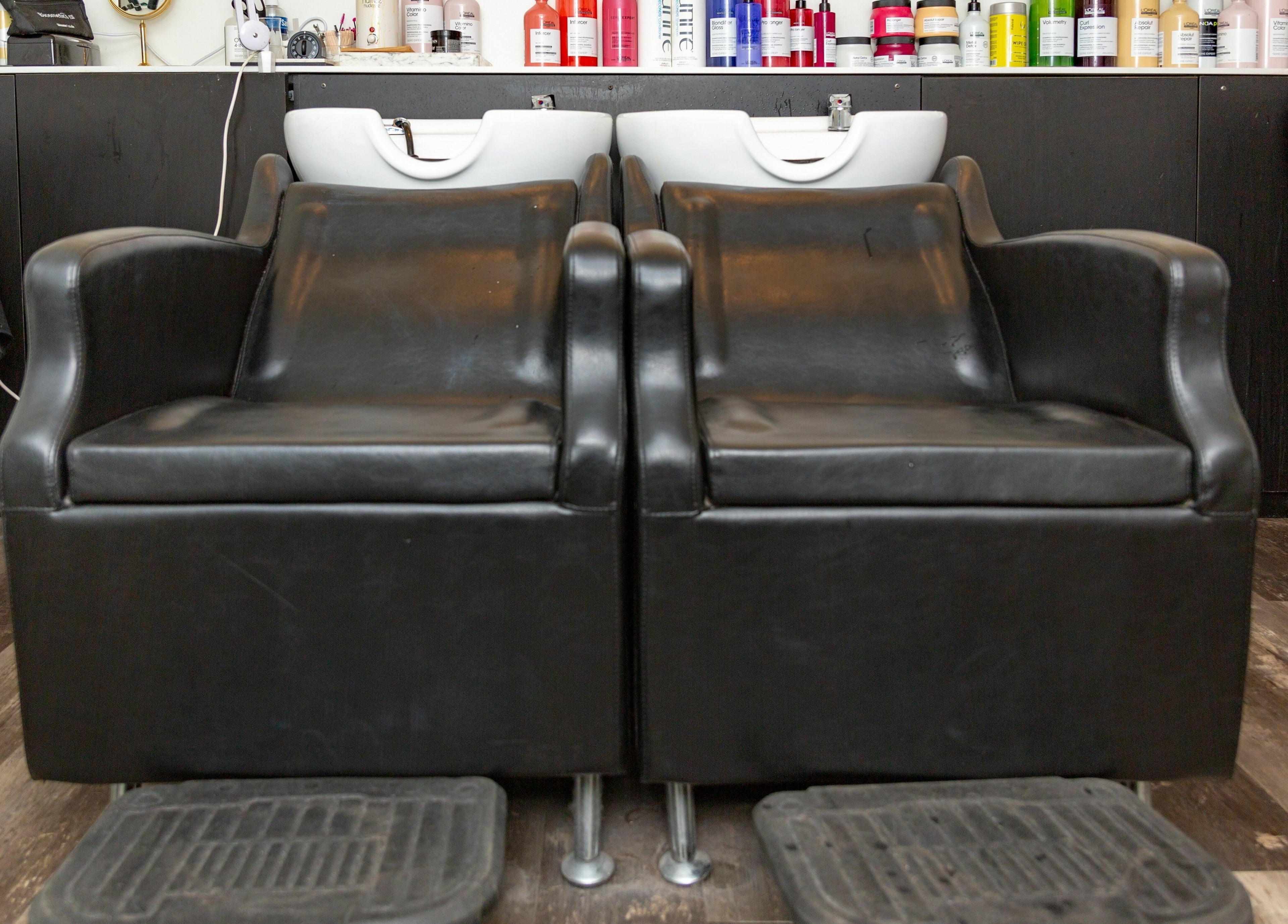 Modern black wash stations at Salon Bloom Color and Co., Glenshaw, Pennsylvania, US, ready for clients.