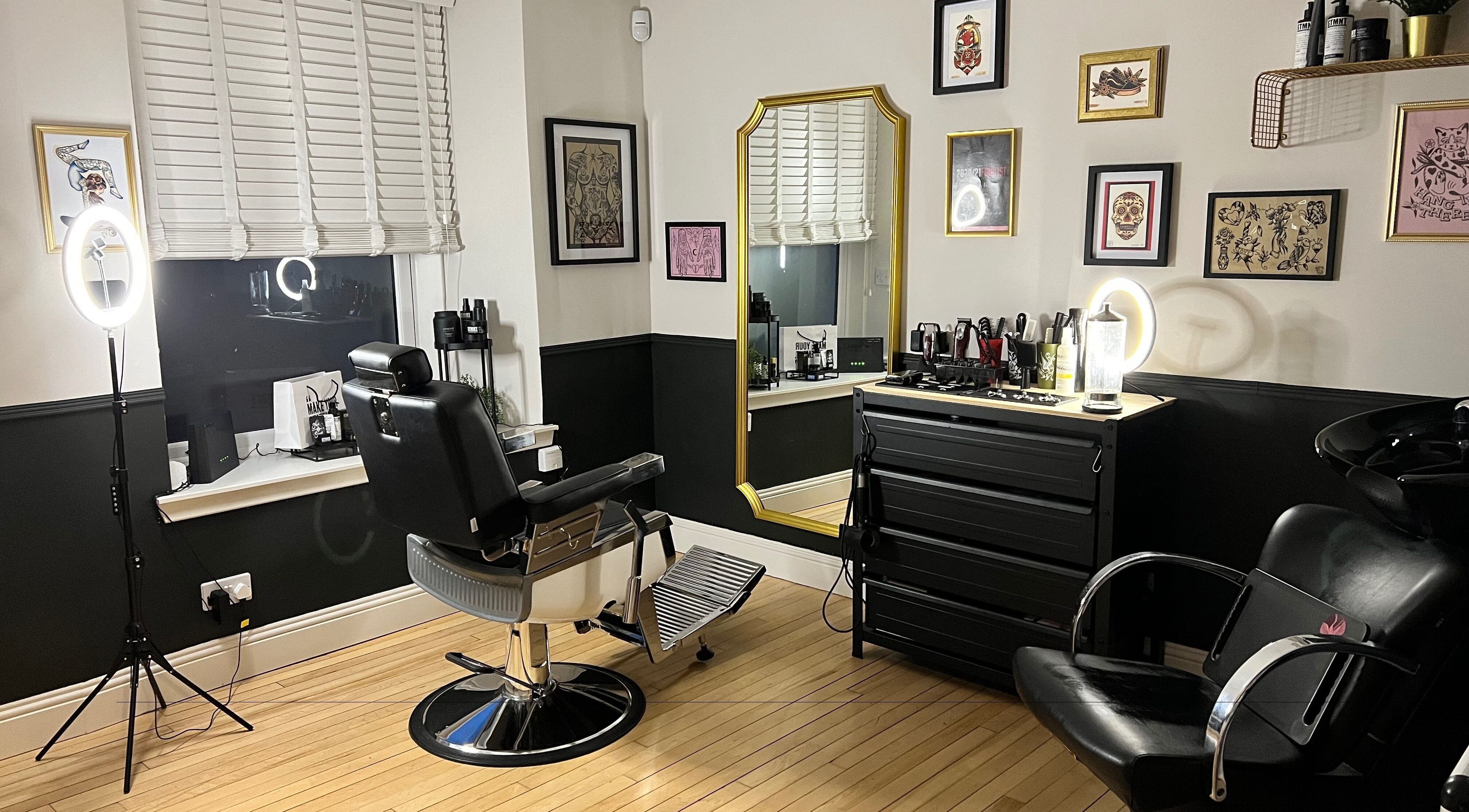 Stylish barber room at New Street Collective, Bridge Of Allan, Scotland, featuring elegant decor and modern amenities.