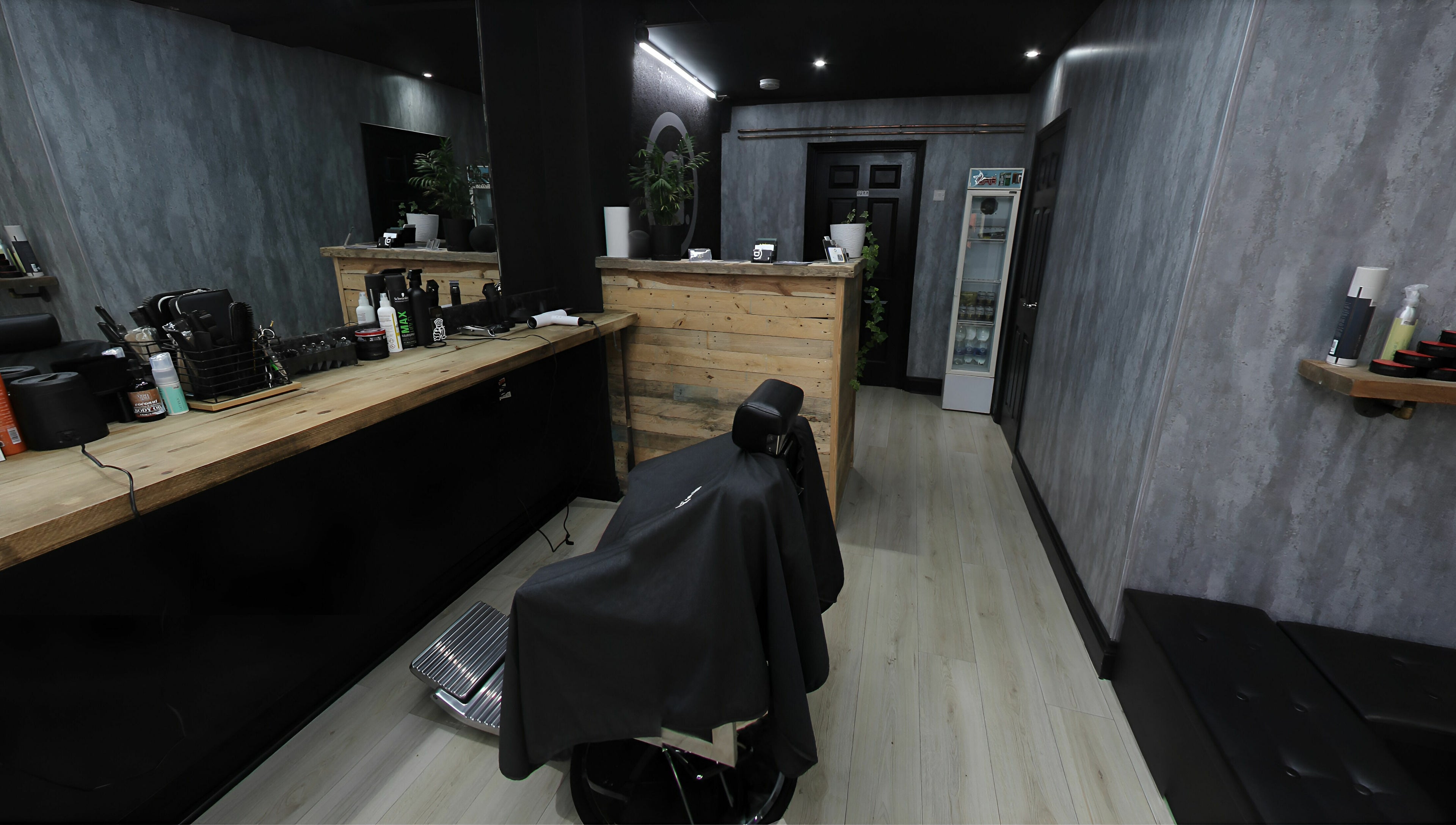 Interior view of Apex Male Grooming, highlighting modern decor and grooming stations in Morpeth, England, GB.