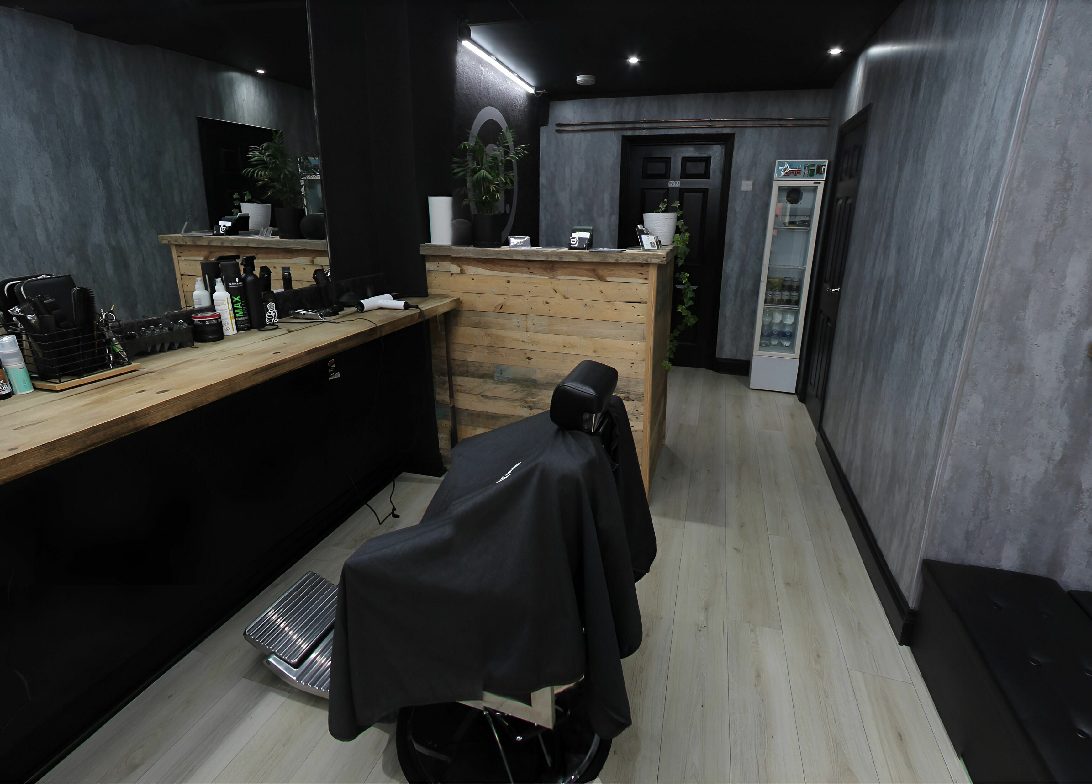 Interior view of Apex Male Grooming, highlighting modern decor and grooming stations in Morpeth, England, GB.