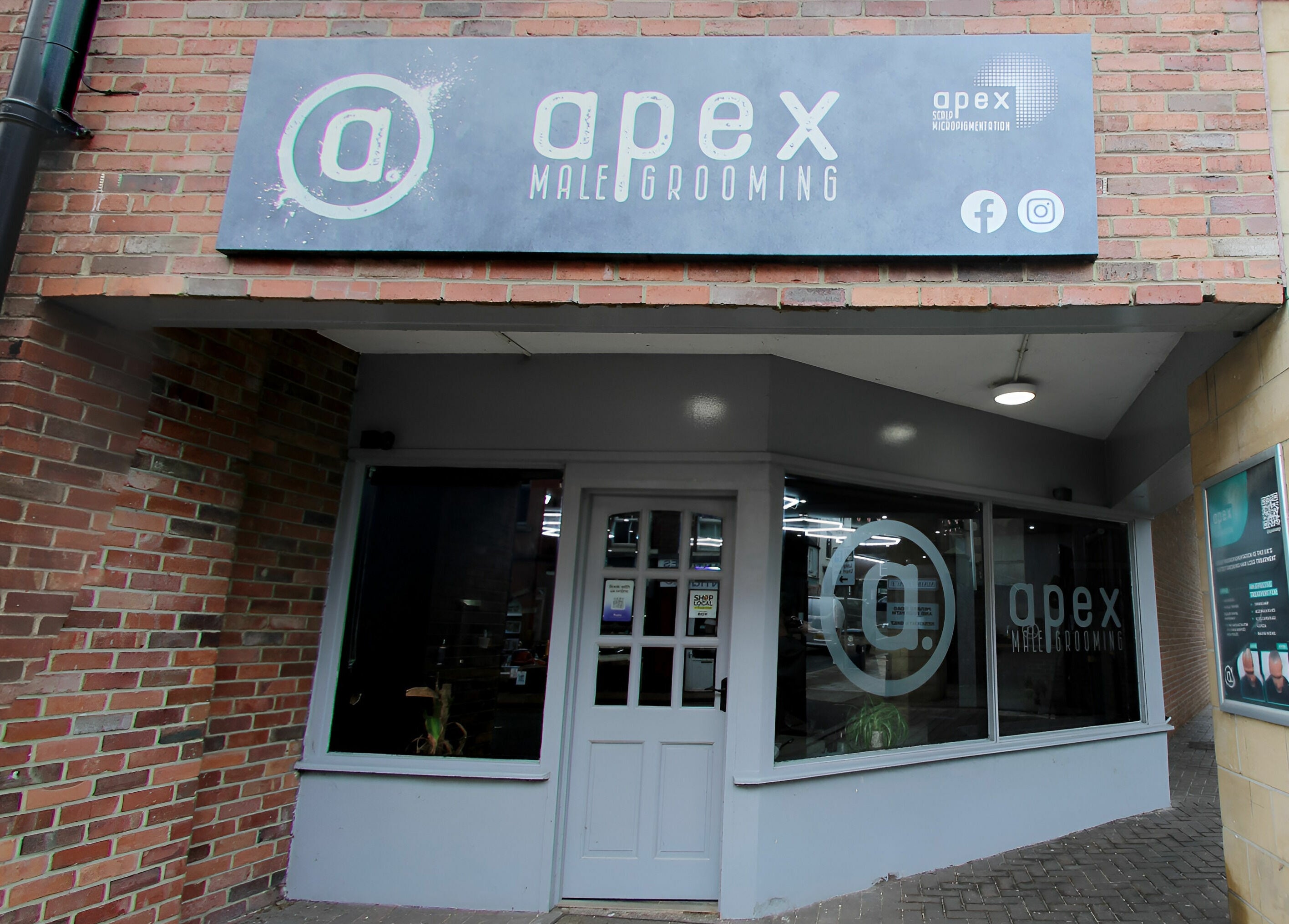 Entrance of Apex Male Grooming located in Morpeth, England, GB, showcasing modern style and branding.