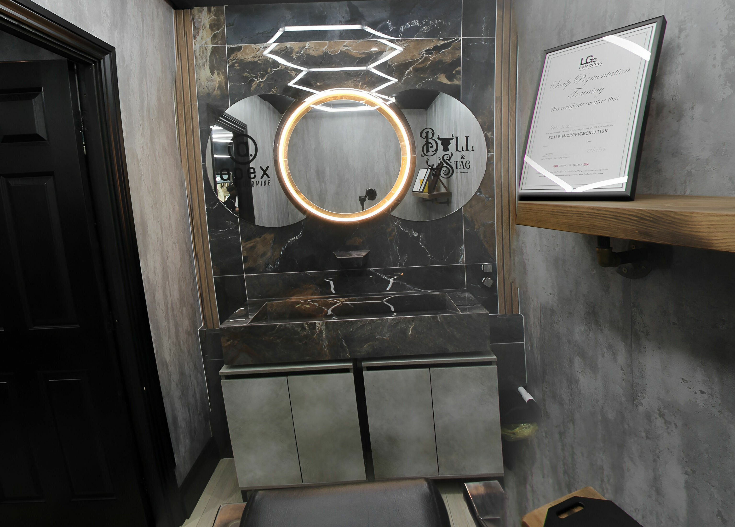 Luxurious grooming station at Apex Male Grooming, Morpeth, England, GB featuring a sleek mirror and modern decor.