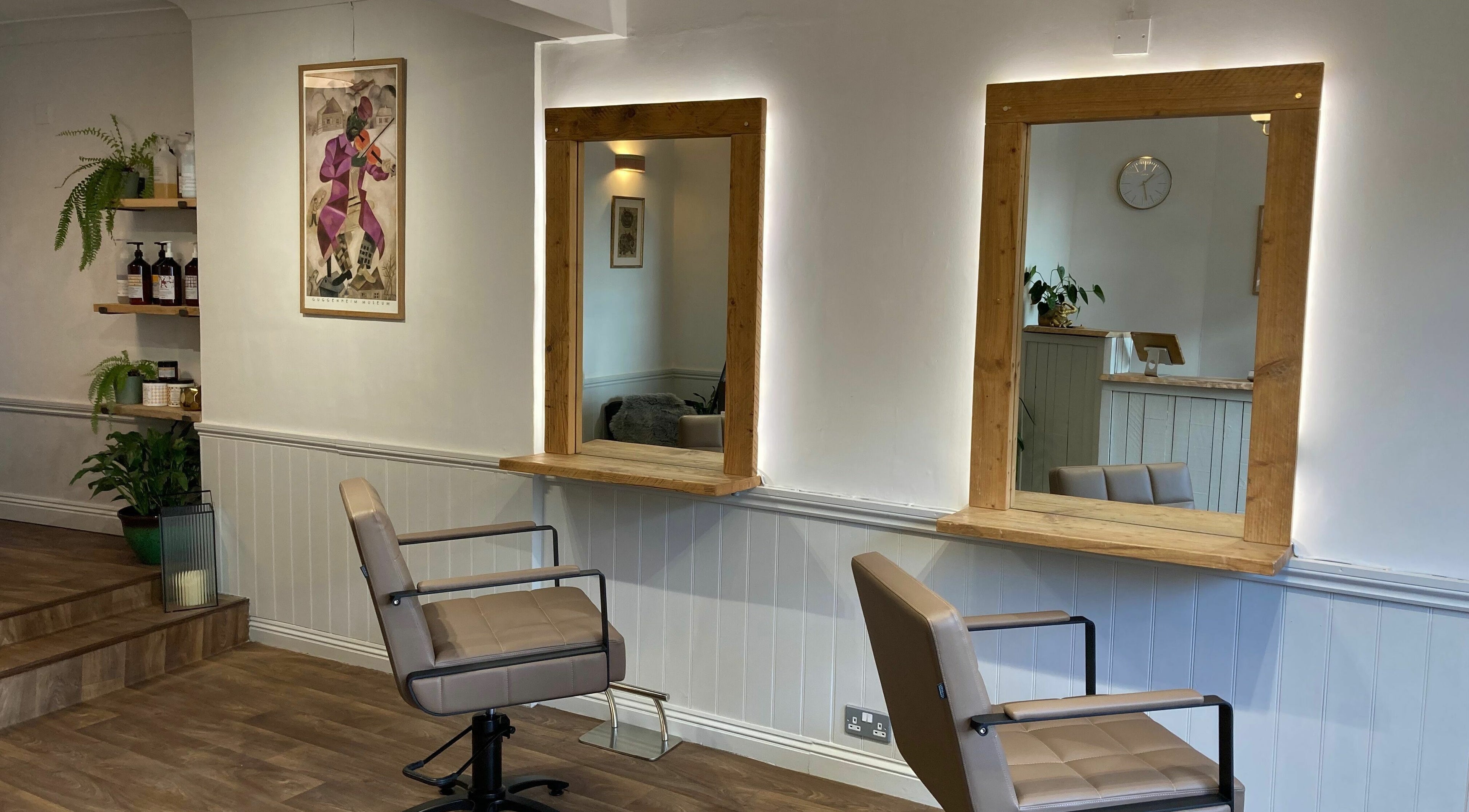 Modern and cozy salon interior at Chavela Mora Hairstyling, Wincanton, England, GB.