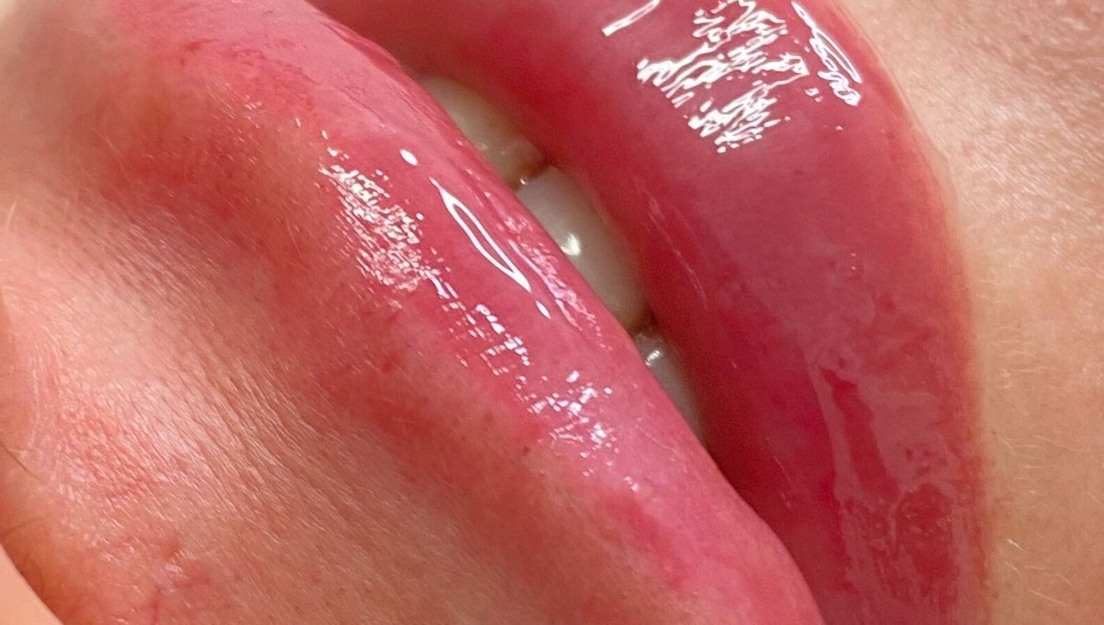 Close-up of glossy lips treated at JCandy Beauty Services, rebranding to Nadra Beauty soon, in Birmingham, England, GB.