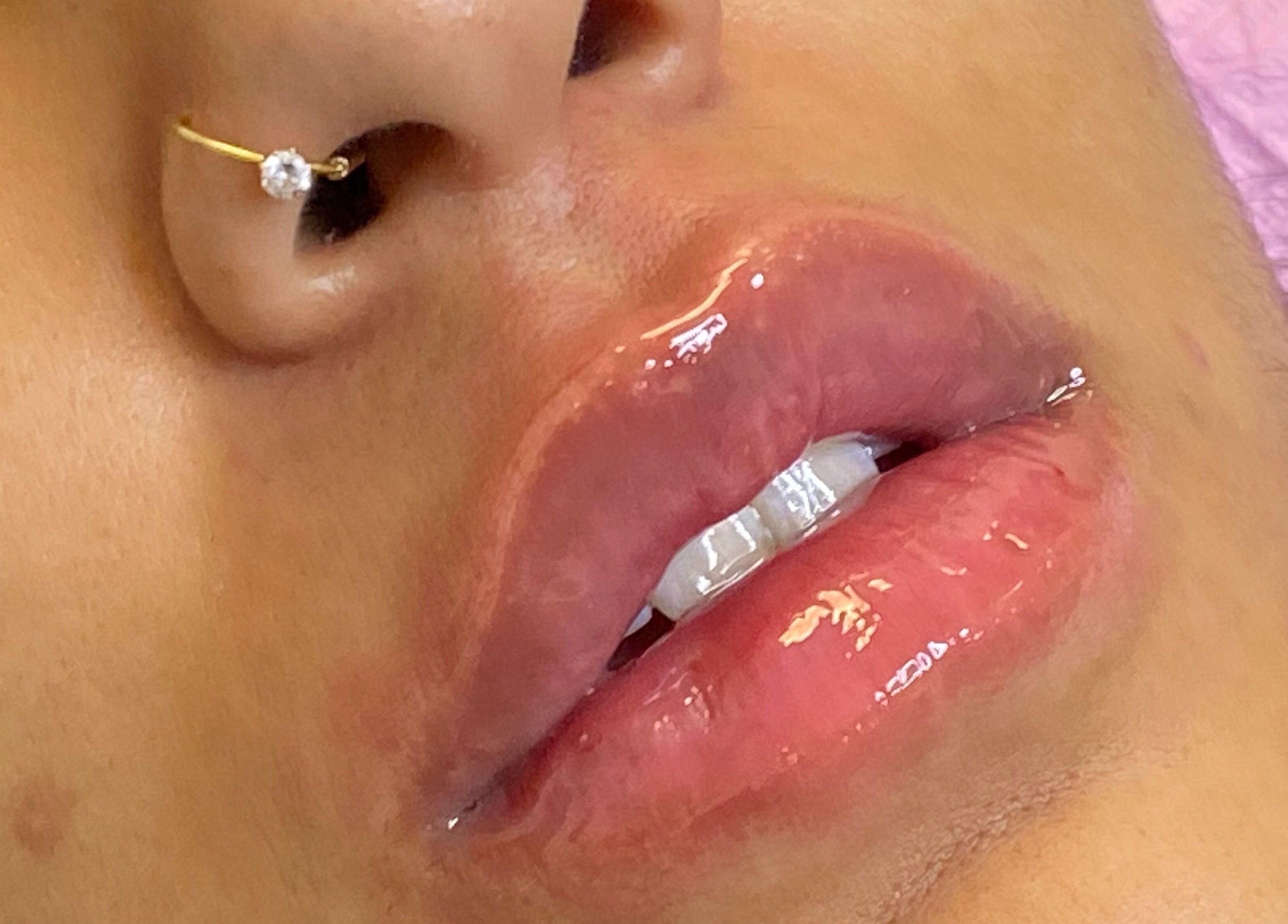 Close-up of glossy lips at JCandy Beauty Services rebranding to Nadra Beauty soon, Birmingham, England, GB.