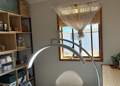 Cozy beauty room at Sarah’s House of Beauty, Killarney Vale, New South Wales, AU, featuring elegant decor and lighting.