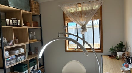 Cozy beauty room at Sarah’s House of Beauty, Killarney Vale, New South Wales, AU, featuring elegant decor and lighting.