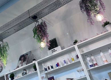 Stylish shelves with products at Thirty-Eight, Washington, England, GB, under elegant hanging lights.