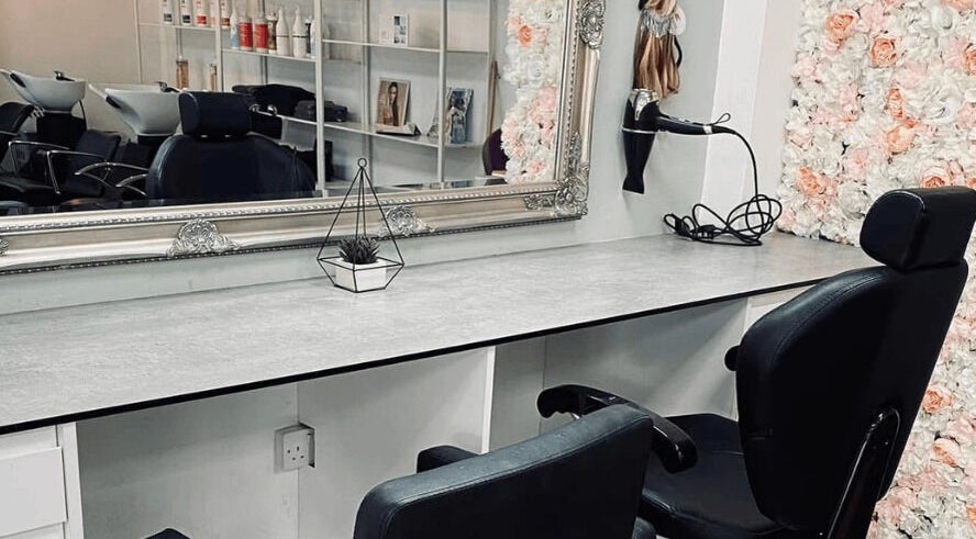 Elegant styling station at Thirty-Eight, Washington, England, GB with floral decor and modern seating.