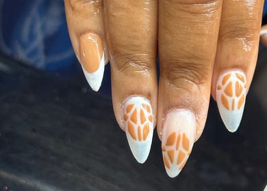 Stylish nail art at Amelia boutique in Carlton In Lindrick, England, GB, featuring intricate patterns.