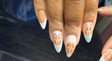 Stylish nail art at Amelia boutique in Carlton In Lindrick, England, GB, featuring intricate patterns.