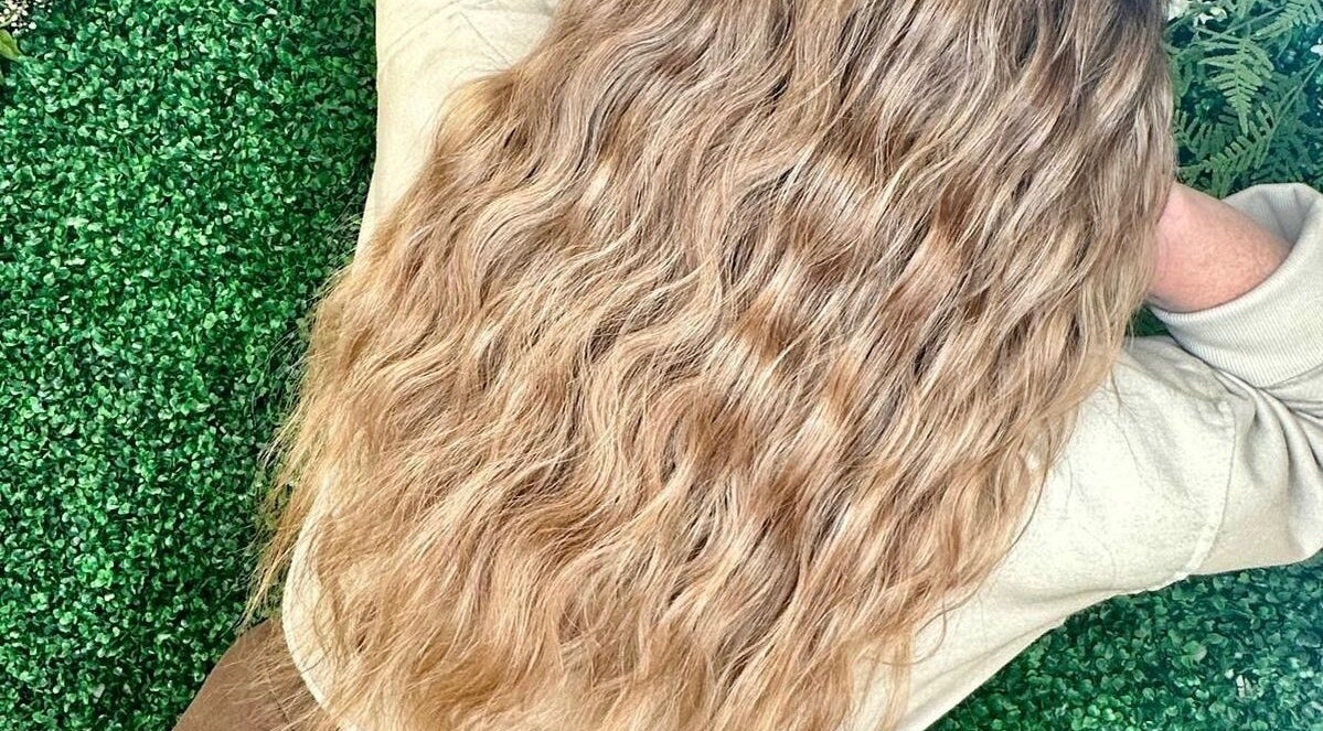 Luscious wavy hair styled at Quintessential Beauty, Market Rasen, England, GB.