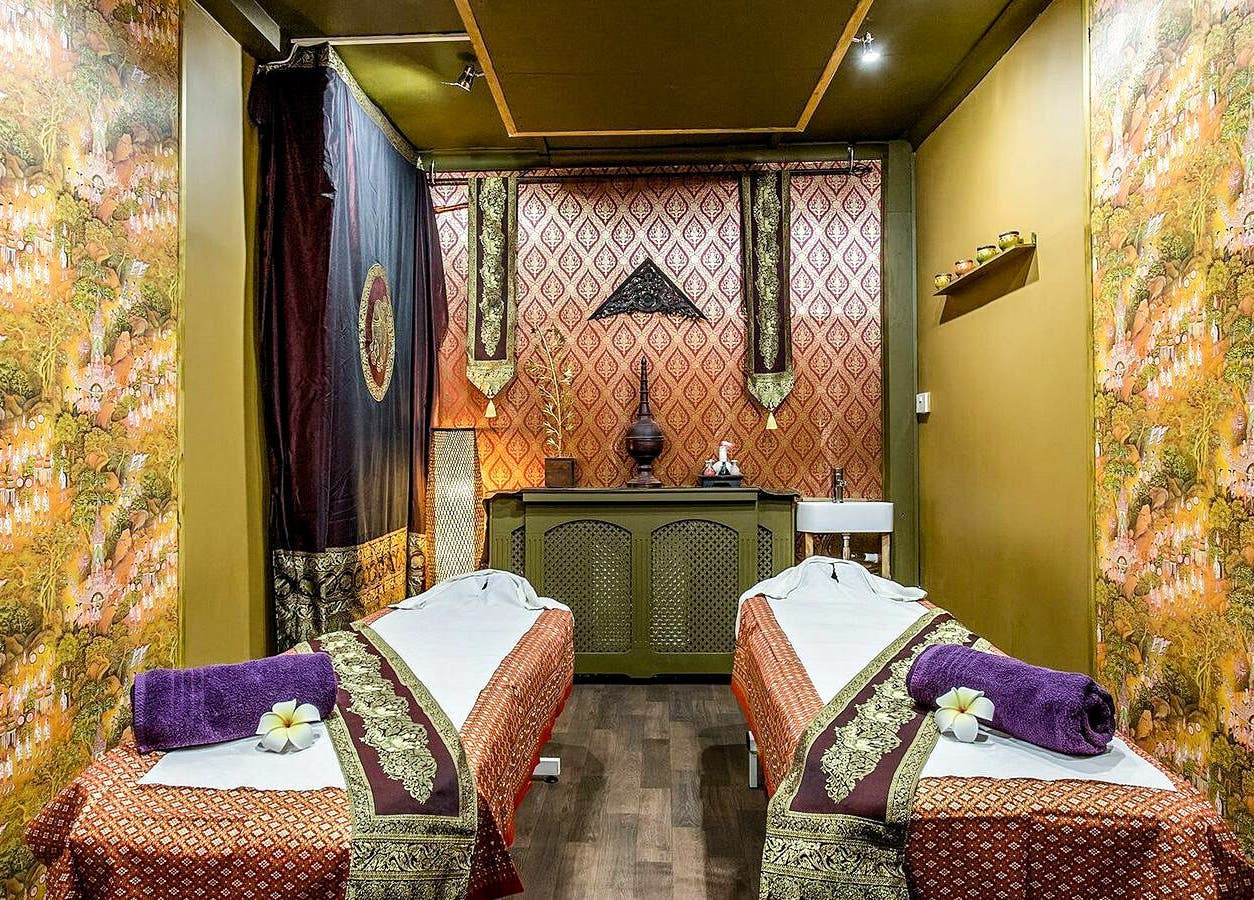 Tranquil massage room at Wanida Thai Spa Ltd, London, England, GB featuring lush decor and dual treatment beds.
