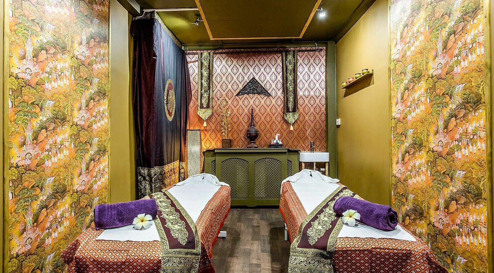 Tranquil massage room at Wanida Thai Spa Ltd, London, England, GB featuring lush decor and dual treatment beds.