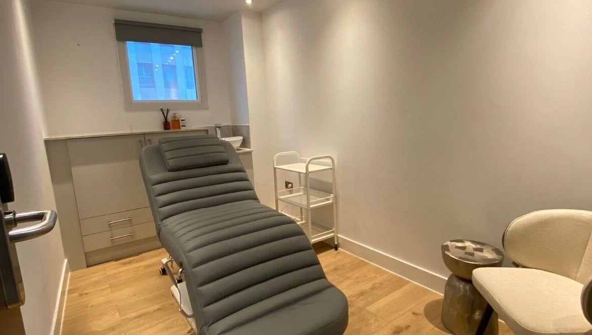Relaxing treatment room at Brow Studio London, located in London, England, GB featuring a comfortable chair.