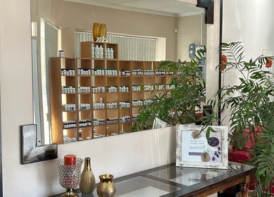 Salon Elkana Health and Beauty's well-stocked shelf and greenery in Vredendal, Western Cape, ZA.