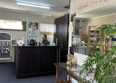 Reception area of Salon Elkana Health and Beauty, Vredendal, Western Cape, ZA, featuring product displays.