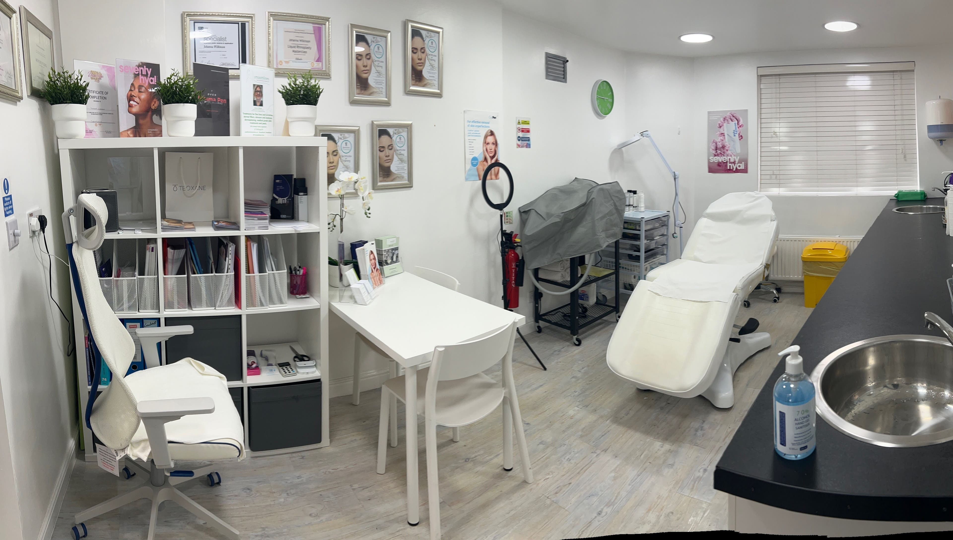 Modern treatment room at Smoothlines Facial Aesthetics, Stockport, England, GB, featuring sleek decor and equipment.