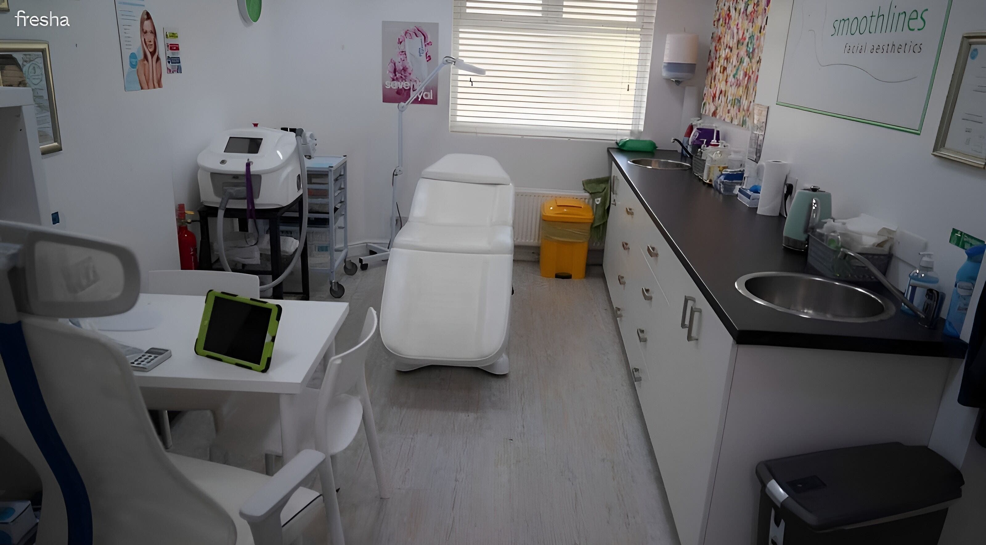 Smoothlines Facial Aesthetics treatment room in Stockport, England, GB featuring modern equipment and soothing decor.
