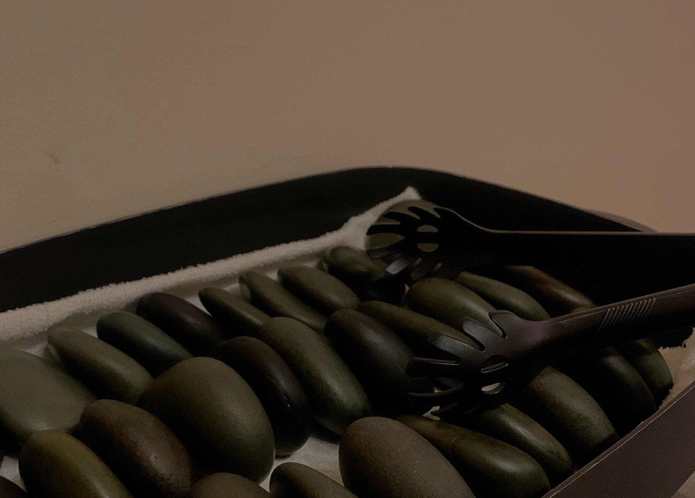 Sleek hot stones ready for a soothing massage at Walvis Bay Branch, Walvis Bay, Erongo Region, NA.