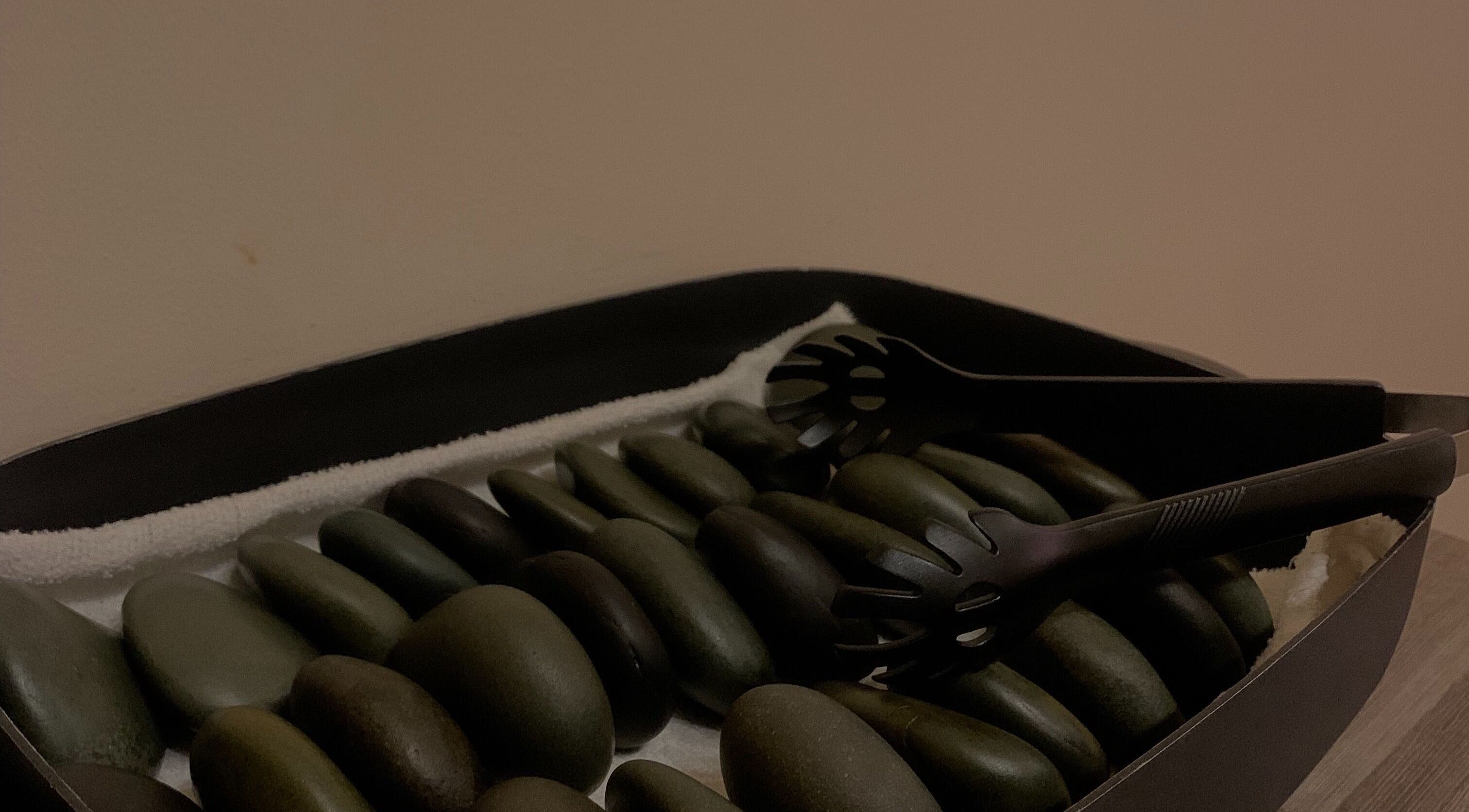 Sleek hot stones ready for a soothing massage at Walvis Bay Branch, Walvis Bay, Erongo Region, NA.