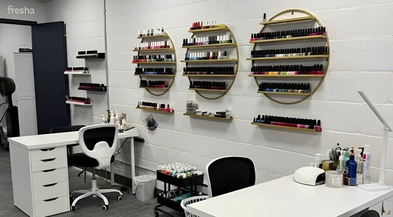 Elegant nail polish display at Beauty Boss & Company in Essex, Ontario, CA, showcasing a modern salon workspace.