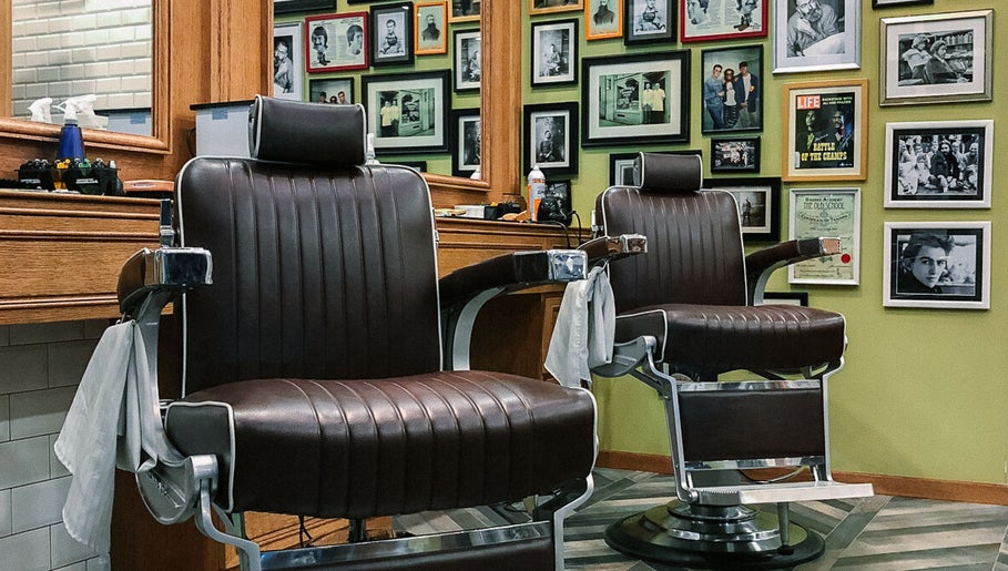 Classic barber chairs at Julian's Barbershop in Dubai, AE showcasing vintage style.