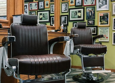 Classic barber chairs at Julian's Barbershop in Dubai, AE showcasing vintage style.