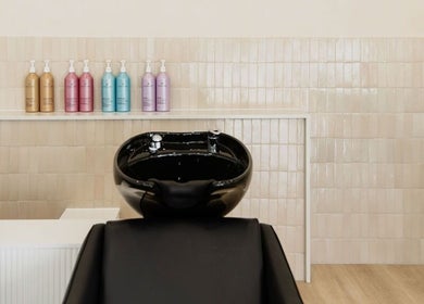 Sleek wash station at Harpar Hair, East Geelong, Victoria, AU with elegant product display.