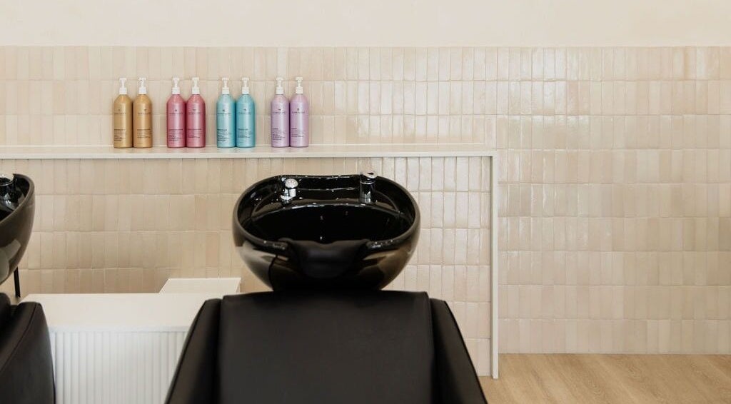 Sleek wash station at Harpar Hair, East Geelong, Victoria, AU with elegant product display.