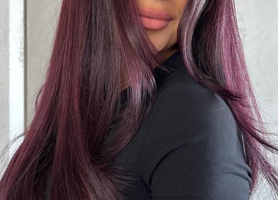 Rich plum hair color styled at Honeycomb Hair Lounge, Regina, Saskatchewan, CA.