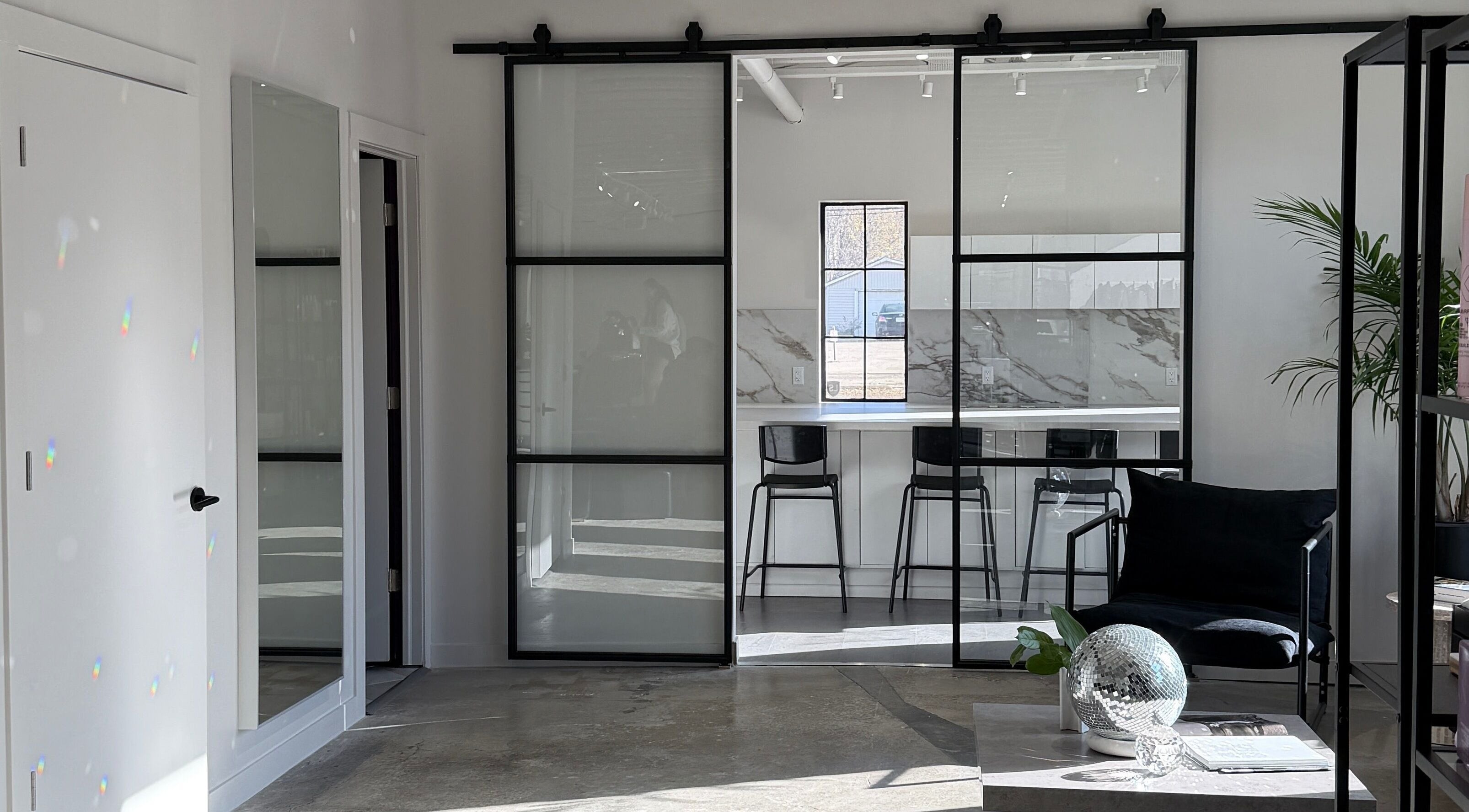Modern interior of Honeycomb Hair Lounge in Regina, Saskatchewan, CA, featuring stylish seating and decor.