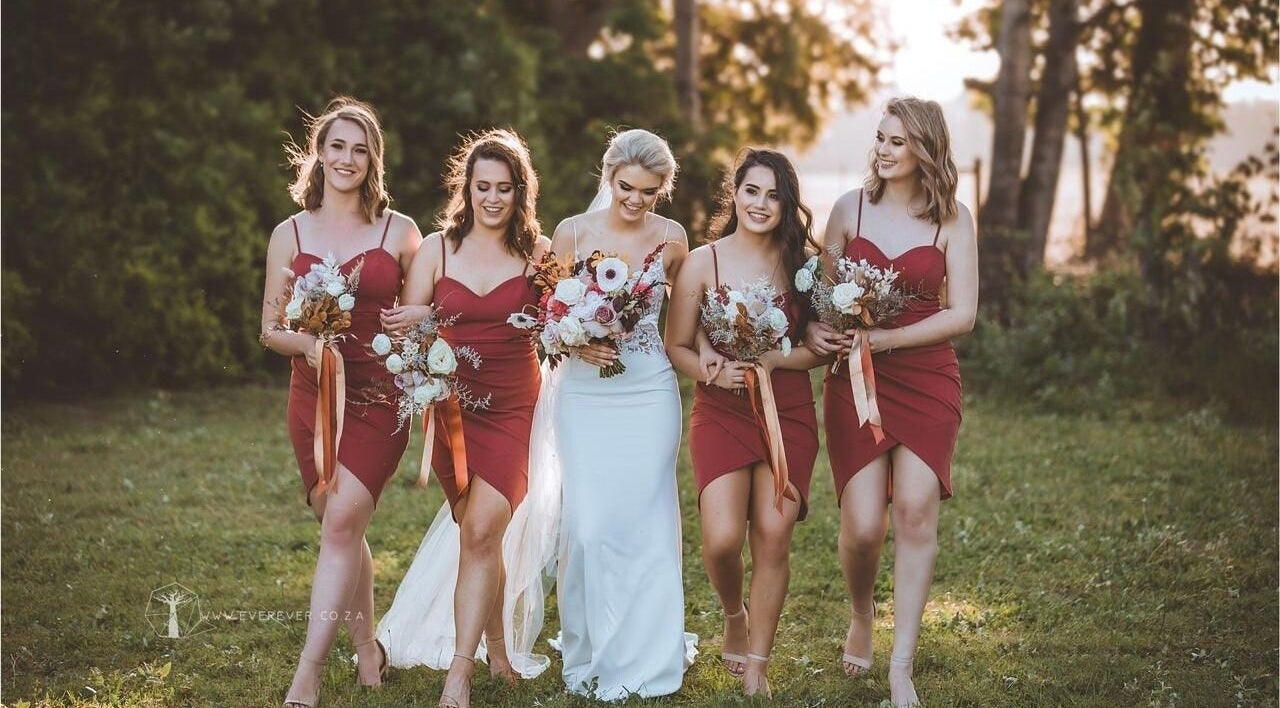 Bridesmaids with bride in lush garden at Go Brown Vredekloof Studio, Brackenfell, Western Cape, ZA