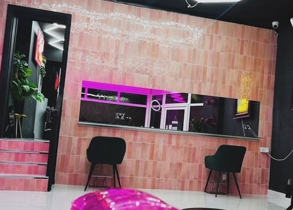 Modern interior of That Glam Bar Goring by Sea, Worthing, England, GB with stylish seating and neon lights.