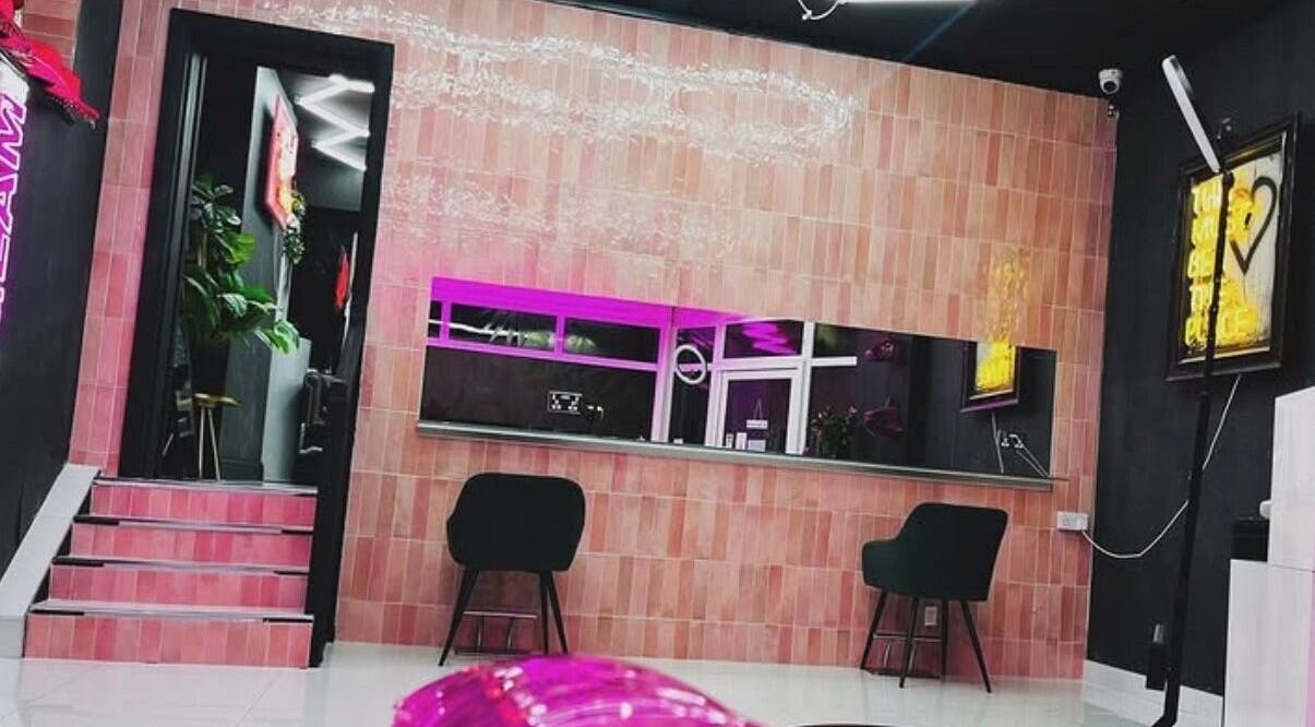 Modern interior of That Glam Bar Goring by Sea, Worthing, England, GB with stylish seating and neon lights.