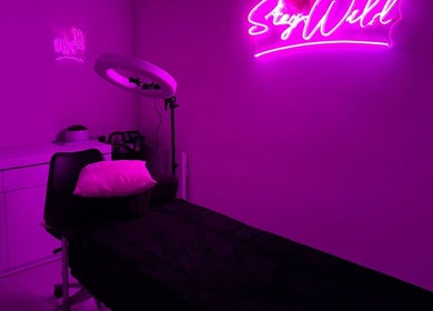 Neon-lit treatment room at That Glam Bar Goring by Sea, Worthing, England, GB.