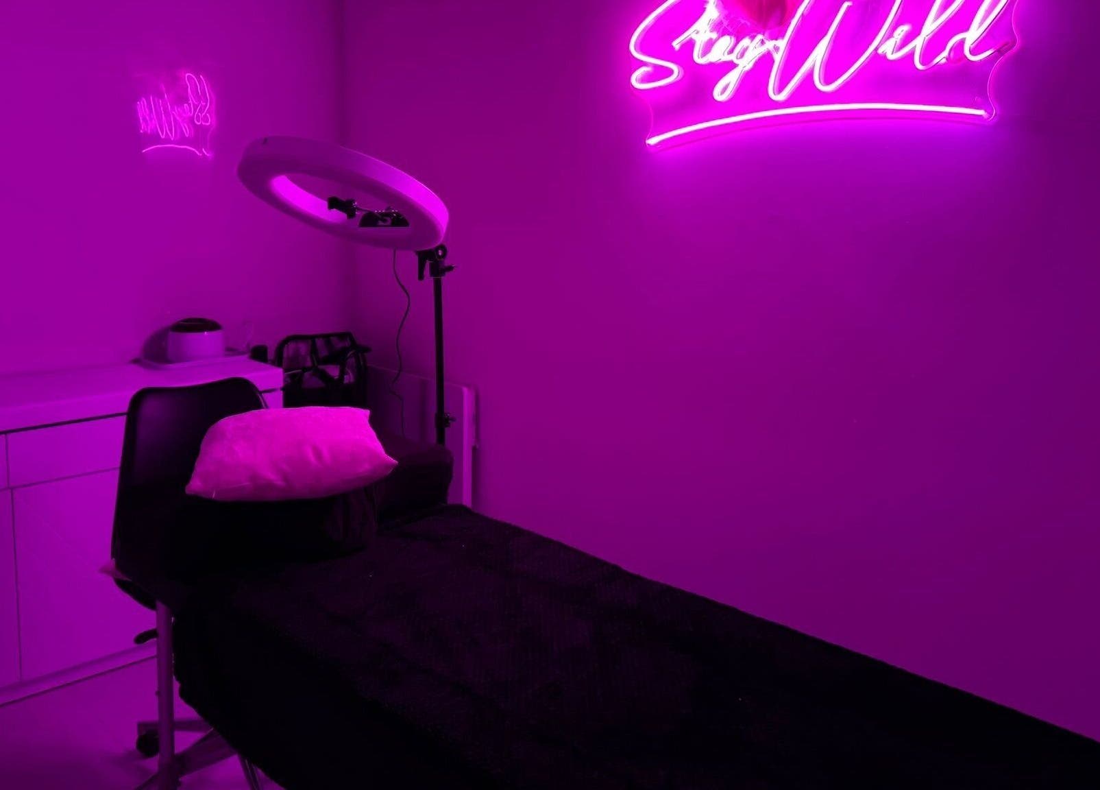 Neon-lit treatment room at That Glam Bar Goring by Sea, Worthing, England, GB.