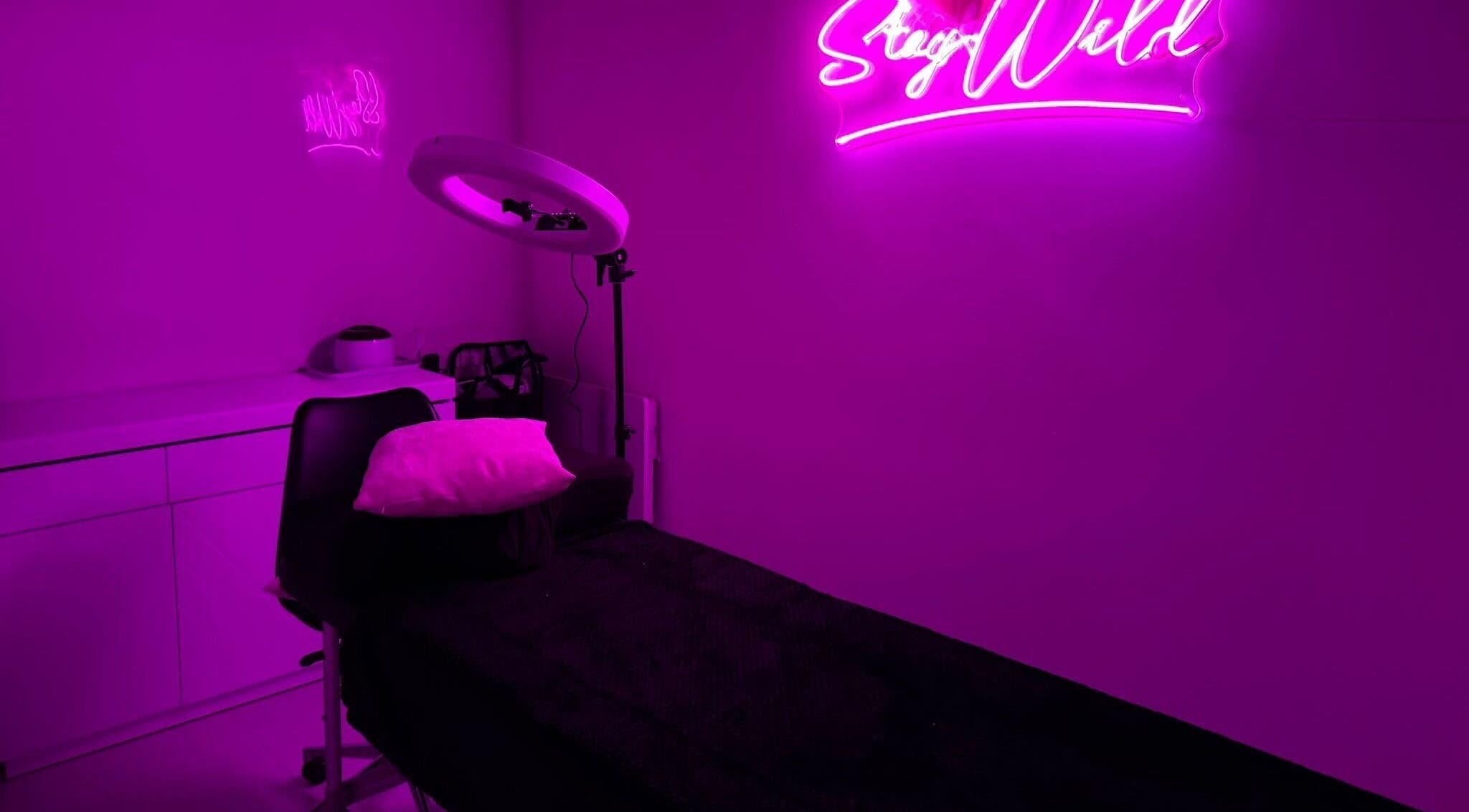 Neon-lit treatment room at That Glam Bar Goring by Sea, Worthing, England, GB.