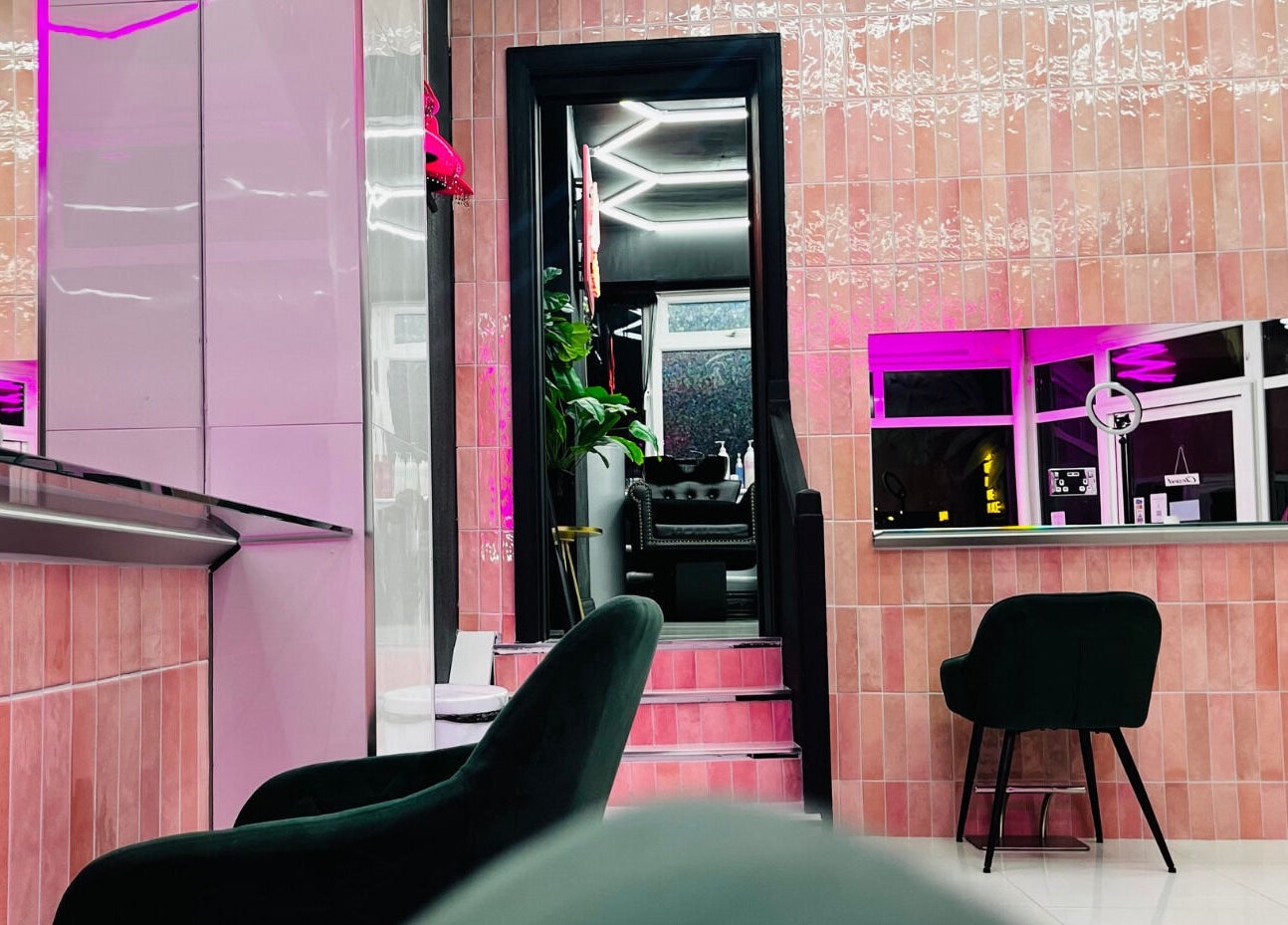 Modern pink interior at That Glam Bar Goring by Sea, Worthing, England, GB with chic seating and vibrant lighting.