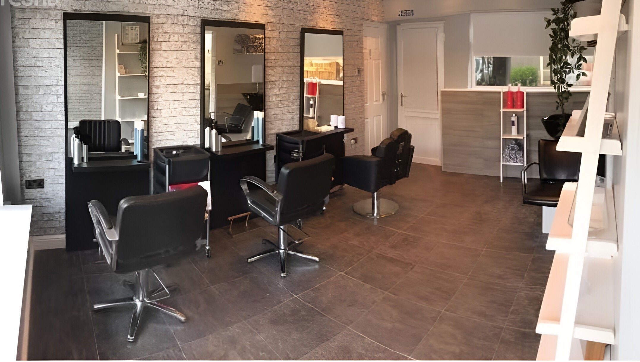 Modern salon interior at L&A Hairdressing and Beauty in Ruddington, England, GB featuring stylish hair stations.
