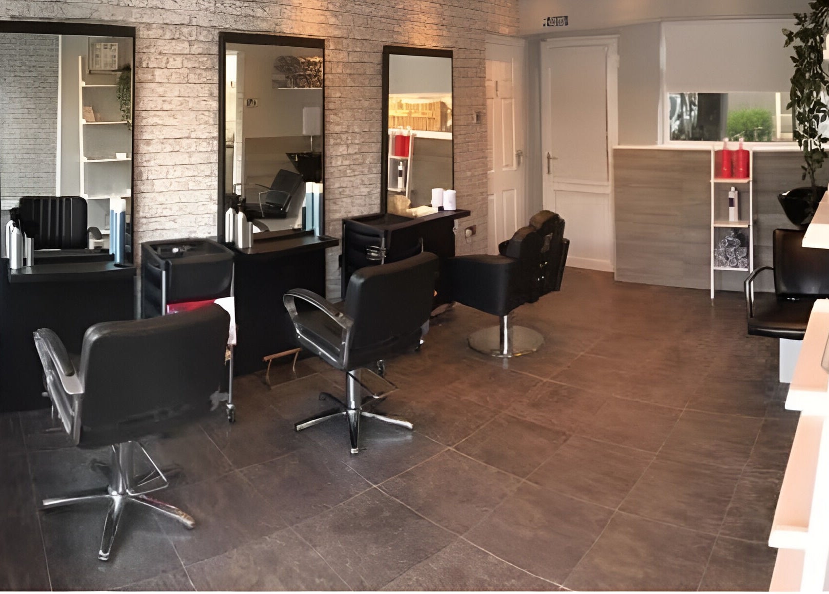 Modern salon interior at L&A Hairdressing and Beauty in Ruddington, England, GB featuring stylish hair stations.