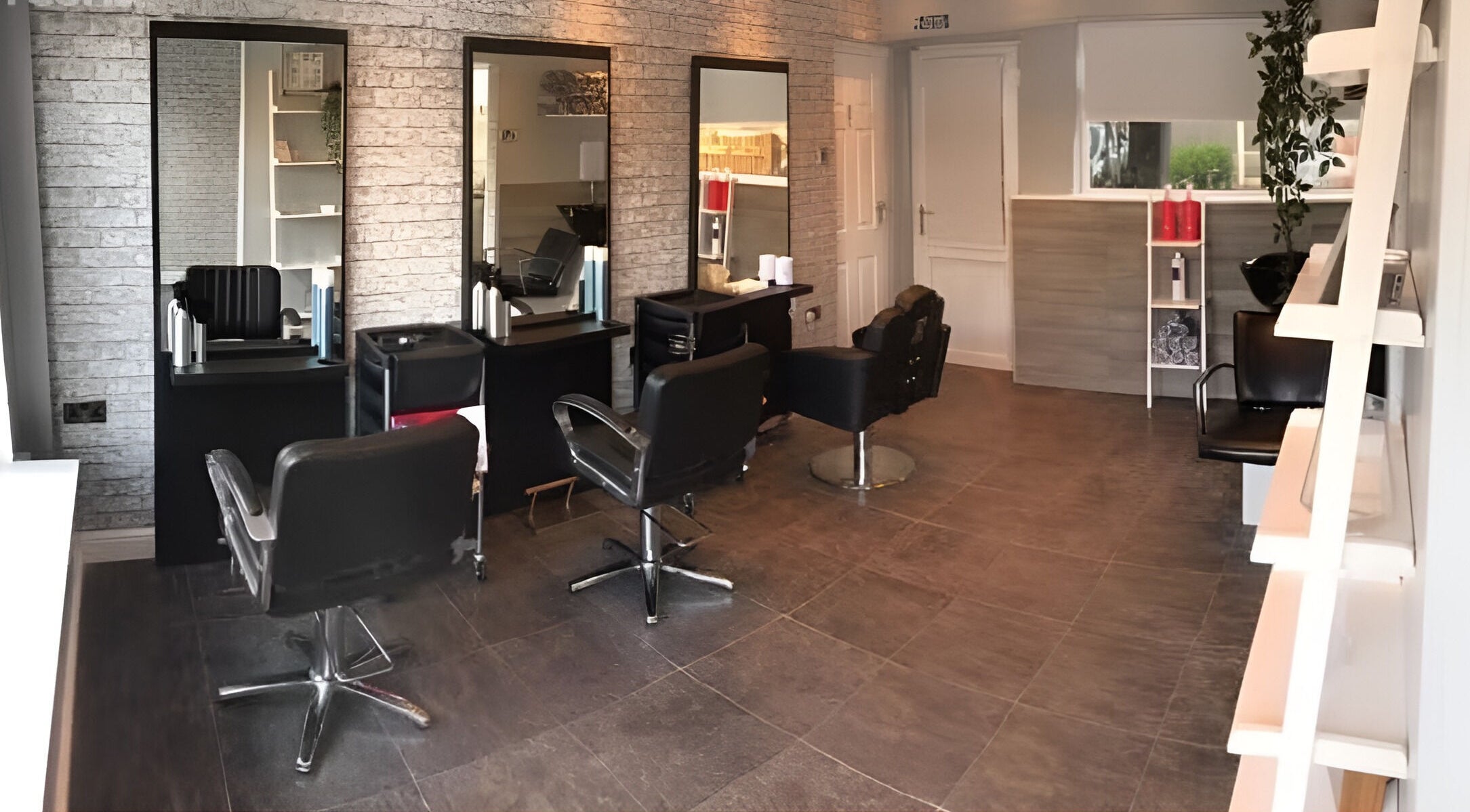 Modern salon interior at L&A Hairdressing and Beauty in Ruddington, England, GB featuring stylish hair stations.