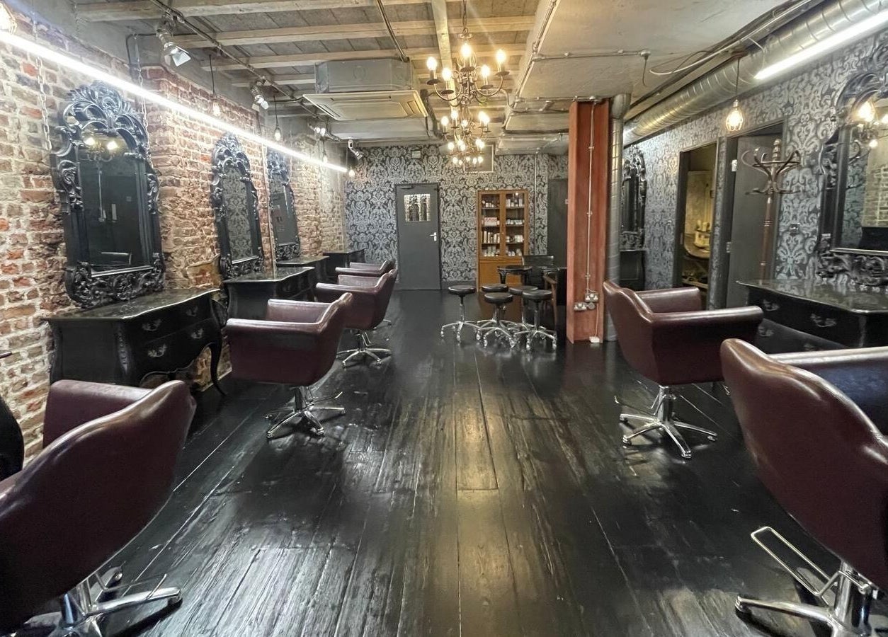 Elegant interior of Hayato London salon in London, England, GB with stylish decor and plush seating.